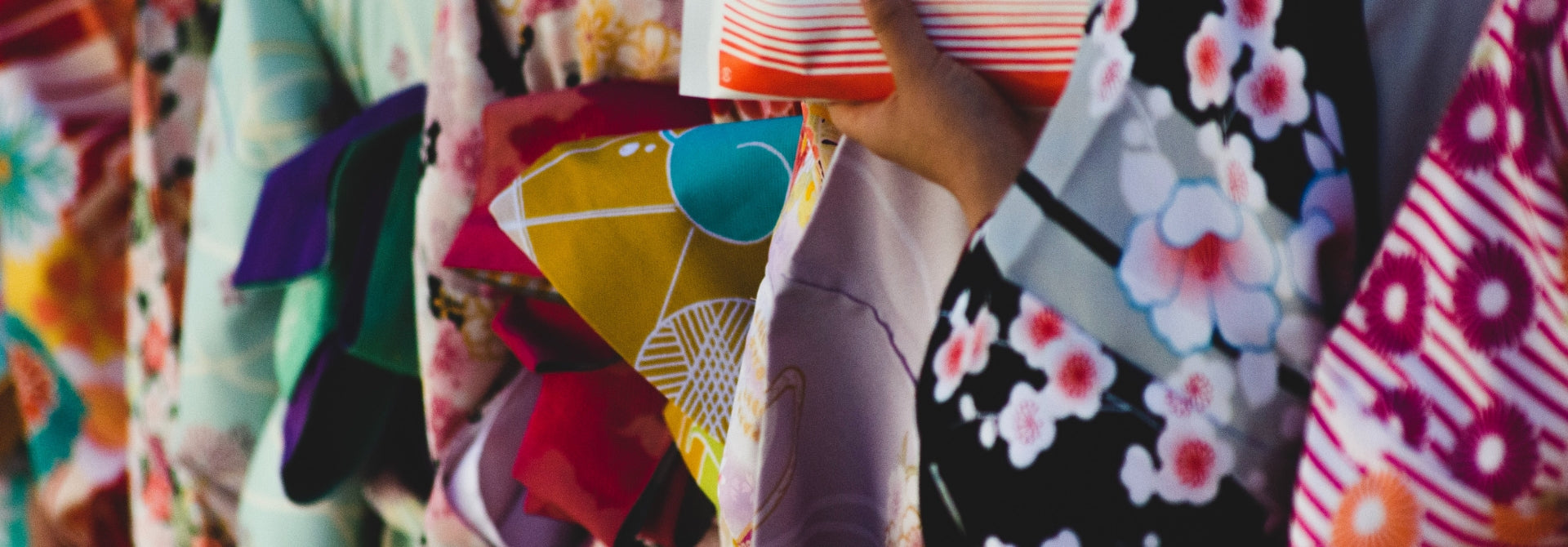 A close-up showcasing a variety of vibrantly patterned kimonos