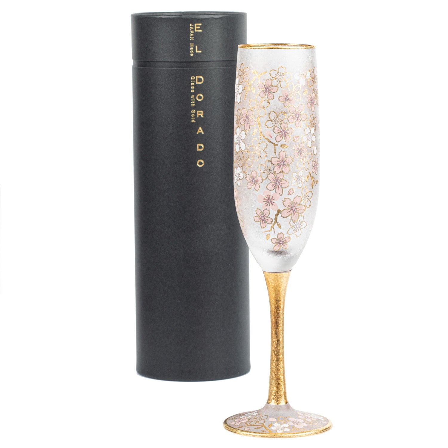 A champagne flute with a gold stem next to its black storage tube labelled "The Japanese Shop"