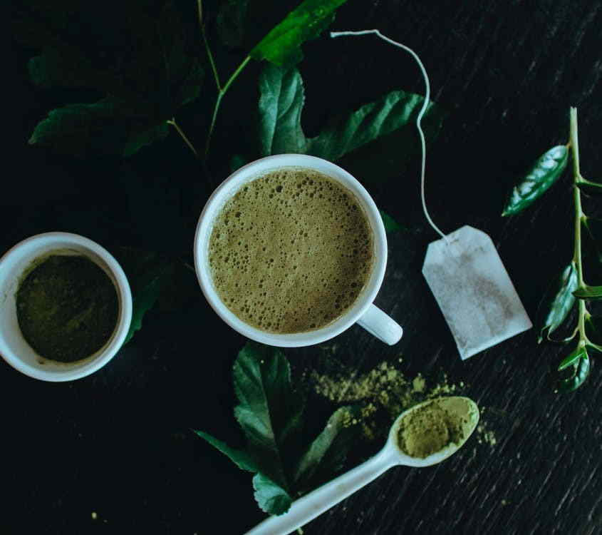 Green matcha tea on a dark background.