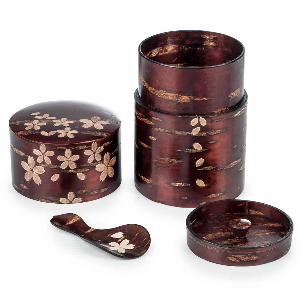 Traditional Japanese tea set with floral details. Includes a stackable cylinder, lidded pot & spoon