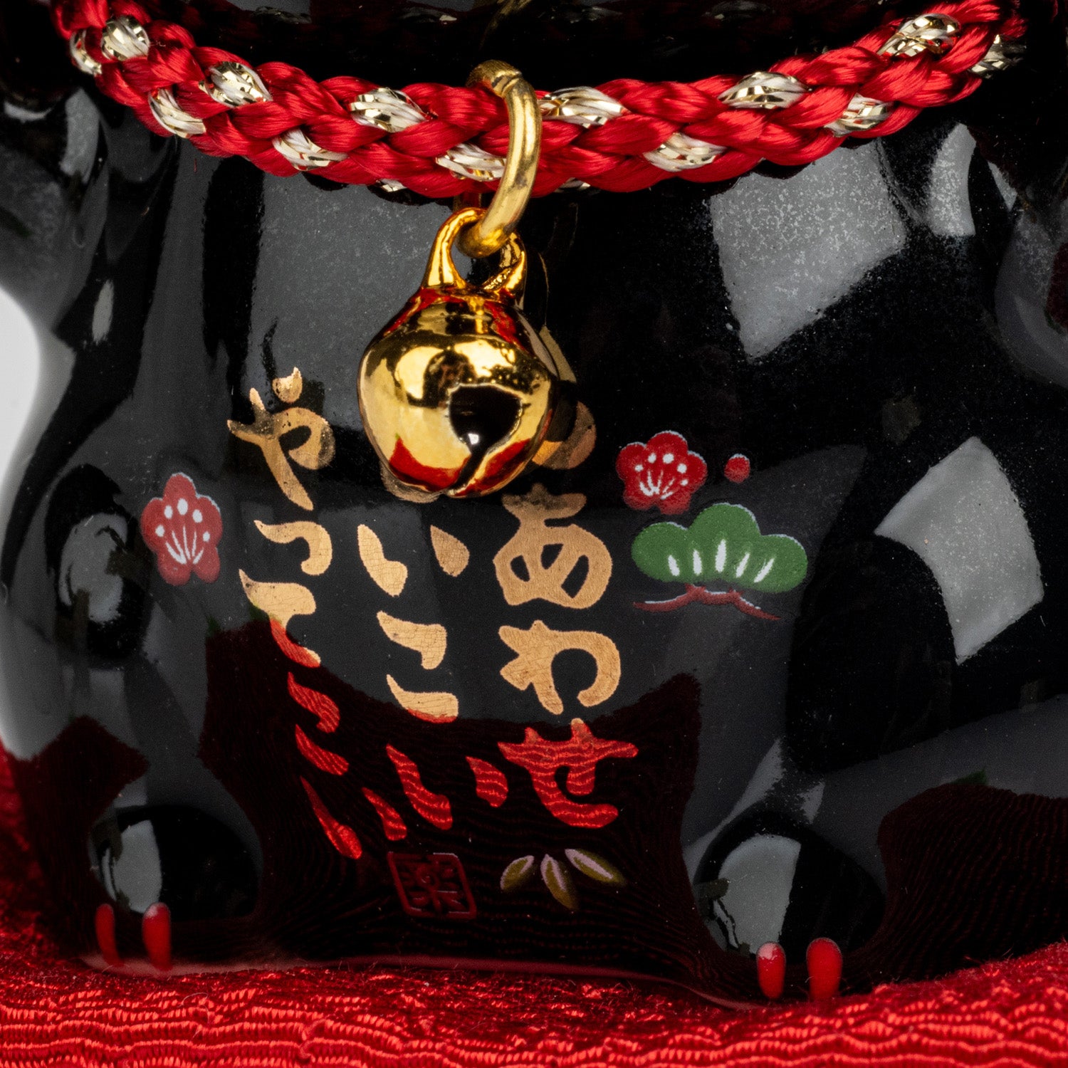 Black Good Health Japanese Lucky Cat and Red Cushion detail