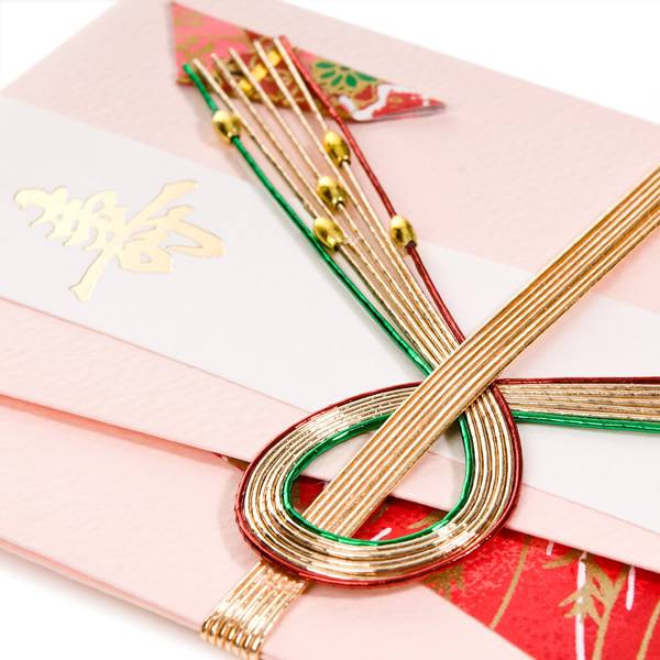 Close-up of genuine Japanese shugi-bukuro money envelopes with golden cords and elegant designs.