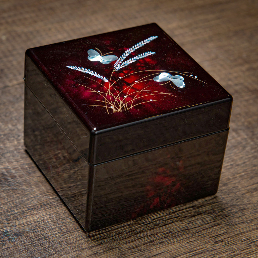 Dark wood square box with delicate floral pattern on the lid