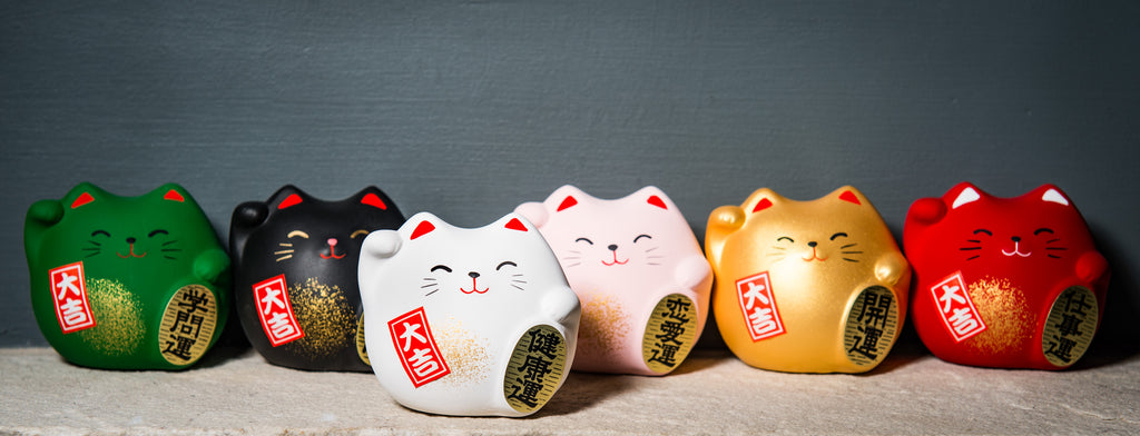 Five vibrant maneki-neko (lucky cat) figurines from The Japanese Shop