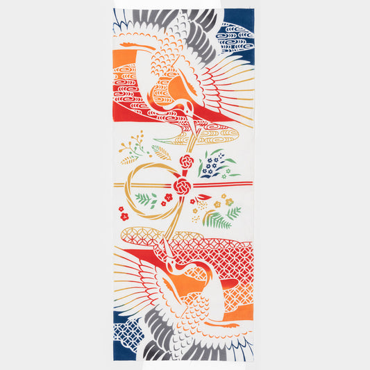 A vivid fabric design with a flying red bird amid intricate orange, blue, and white floral motifs